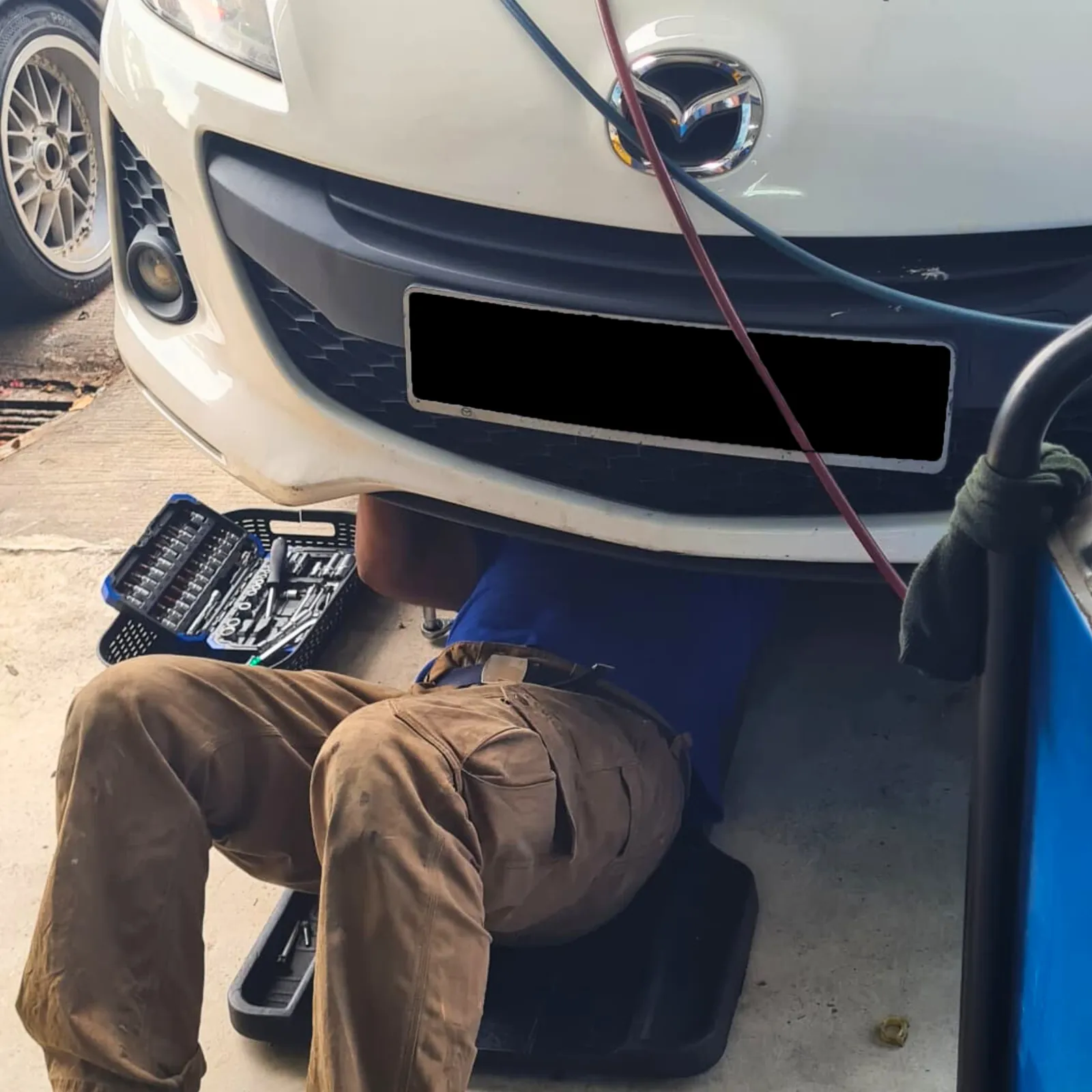 Mazda receiving aircond repair at Kool Aire